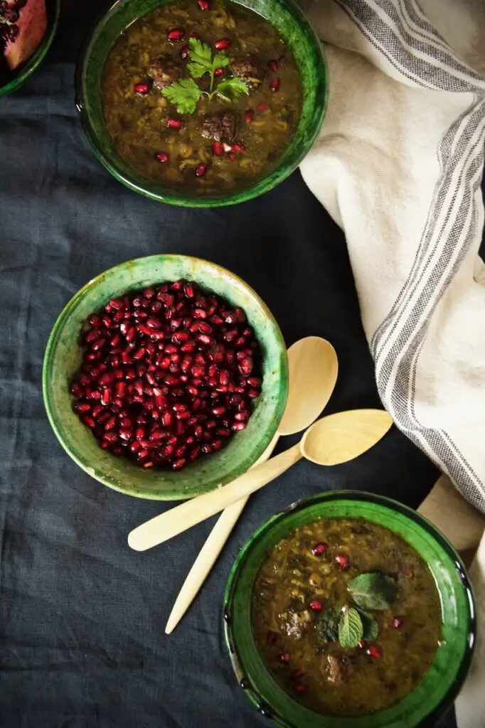 Ash-e Anar ba Koofteh Ghelgheli – Thick Pomegranate Soup with Meatballs and Mint Oil آش انار