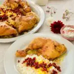 Zereshk Polo ba Morgh - In Safran geschmorte Hühnerkeulen auf Berberitzen-Reis